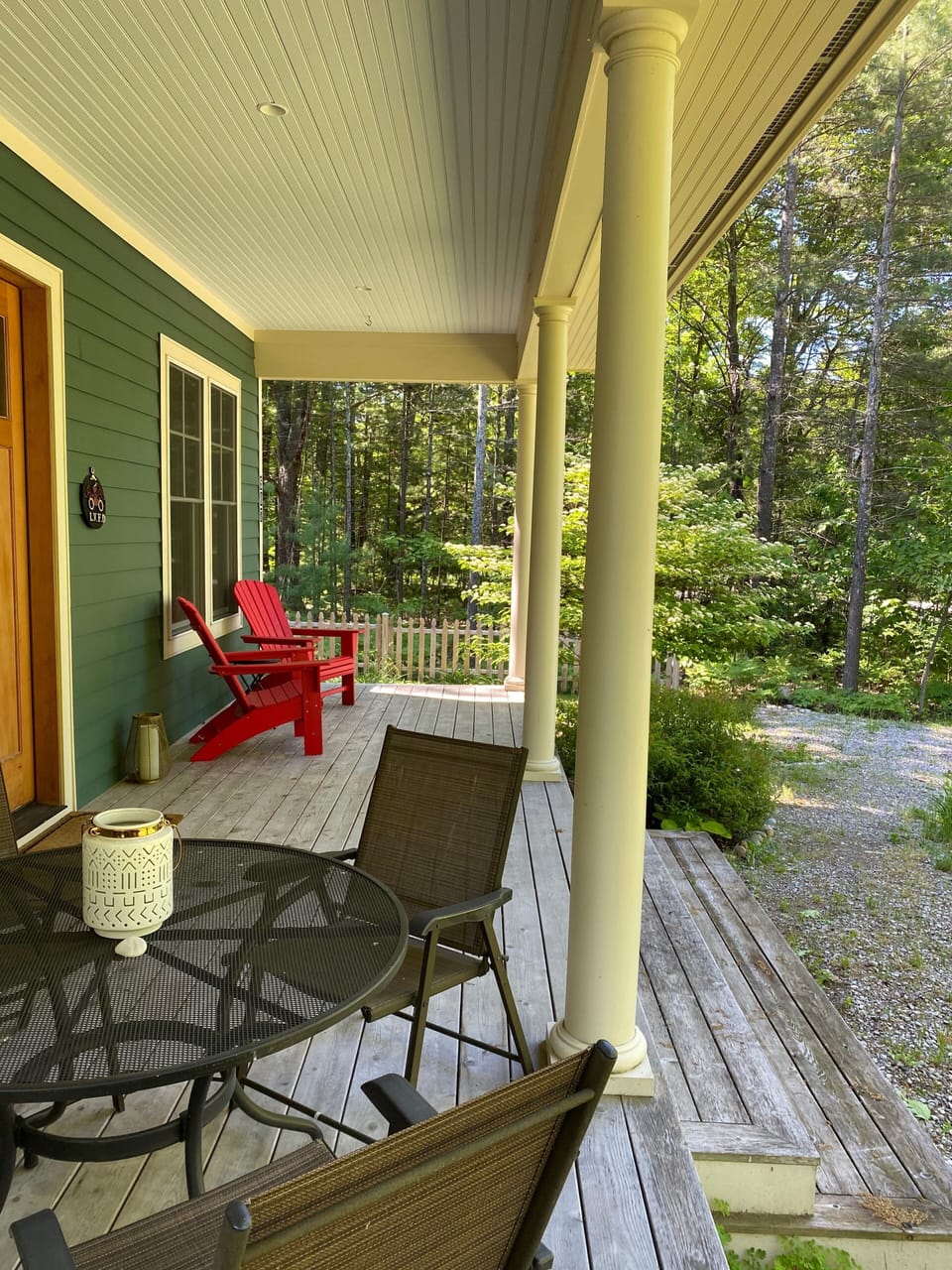 Front porch offers options for dining and lounging