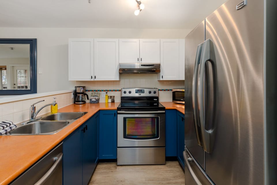Kitchen - Fully equipped with Maytag appliances, cooking utensils, and glassware for gourmet home cooking. Coffee, tea and hot chocolate included.