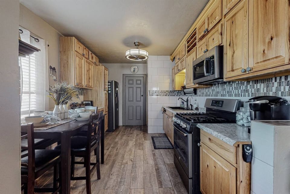 Full kitchen appears here with a view from the living room and front door.