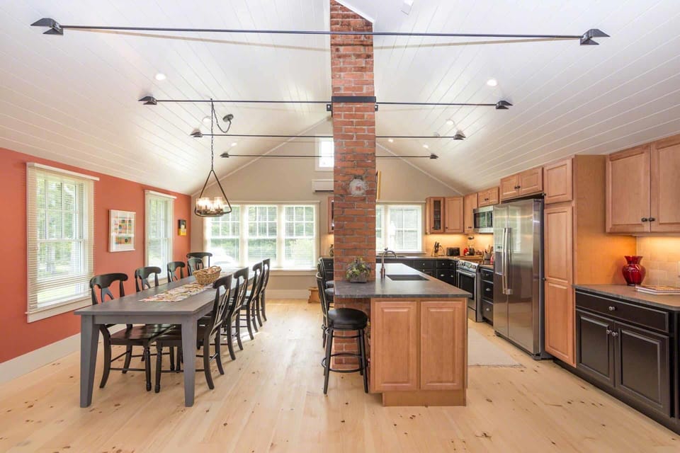 Open Dining and Kitchen Has Vaulted Ceilings