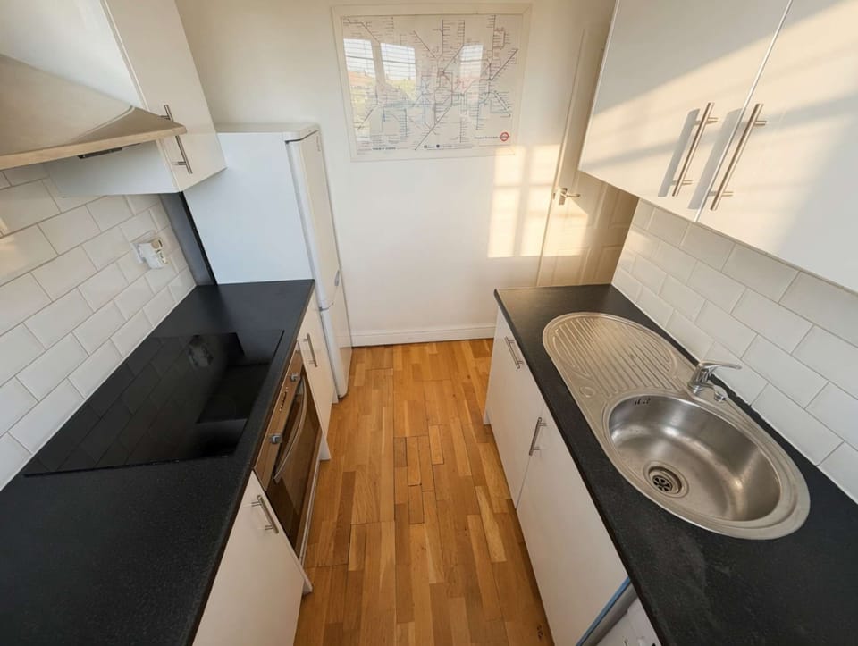 Kitchen with oven, microwave and hob