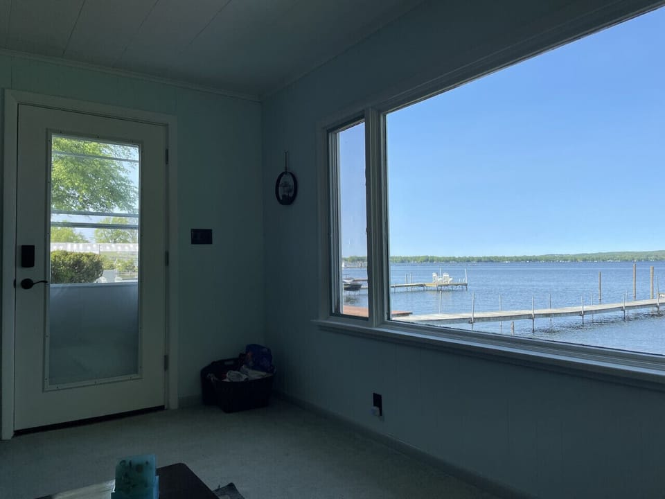 Lakeview from sofa in Livingroom through big window and garden door.