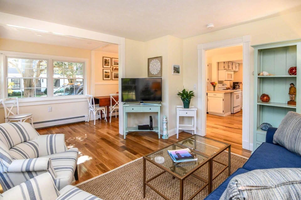 Living Room Is Set Between Dining Area and Kitchen