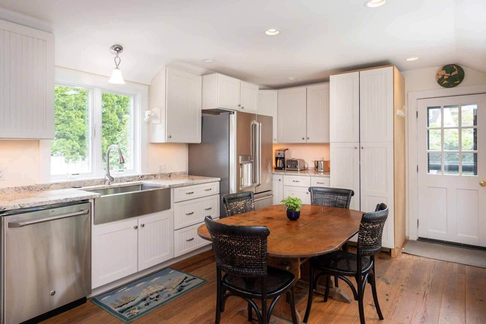 Kitchen Has Granite Counters, Central Dining Area and Opens Out to Spacious Backyard for Outside Dining