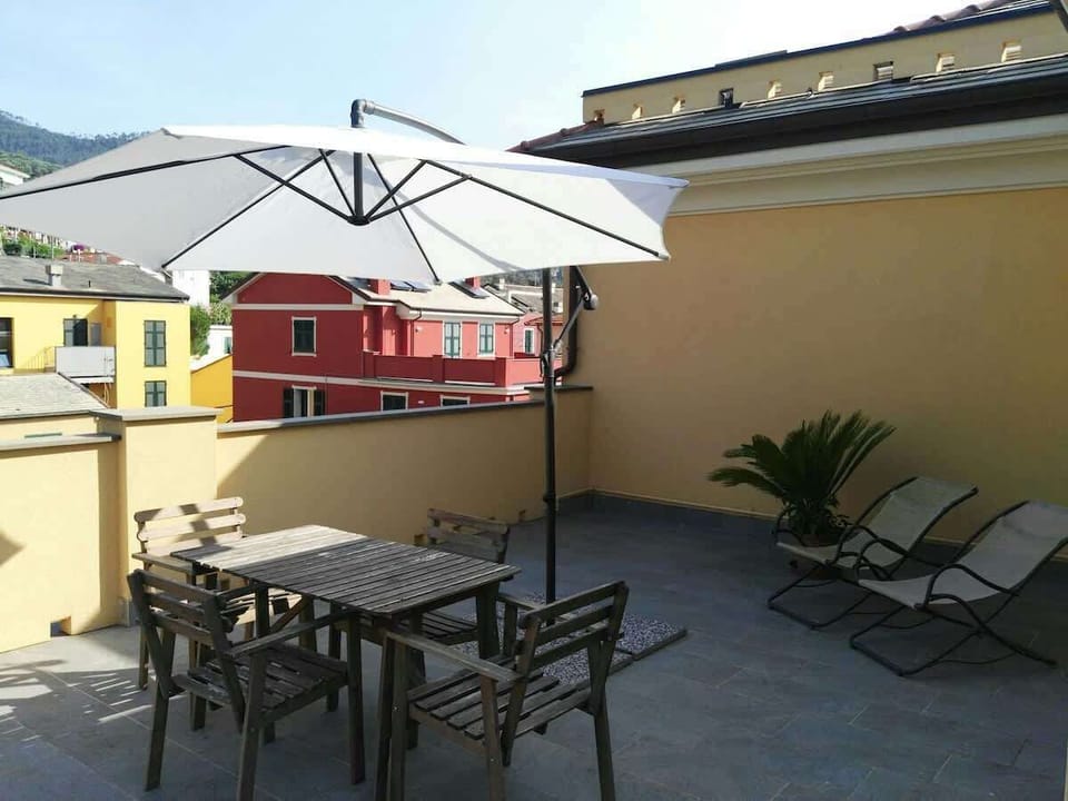 terrace with table and ombrella