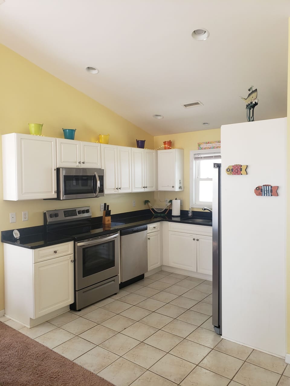 Updated appliances in fully equipped kitchen. 