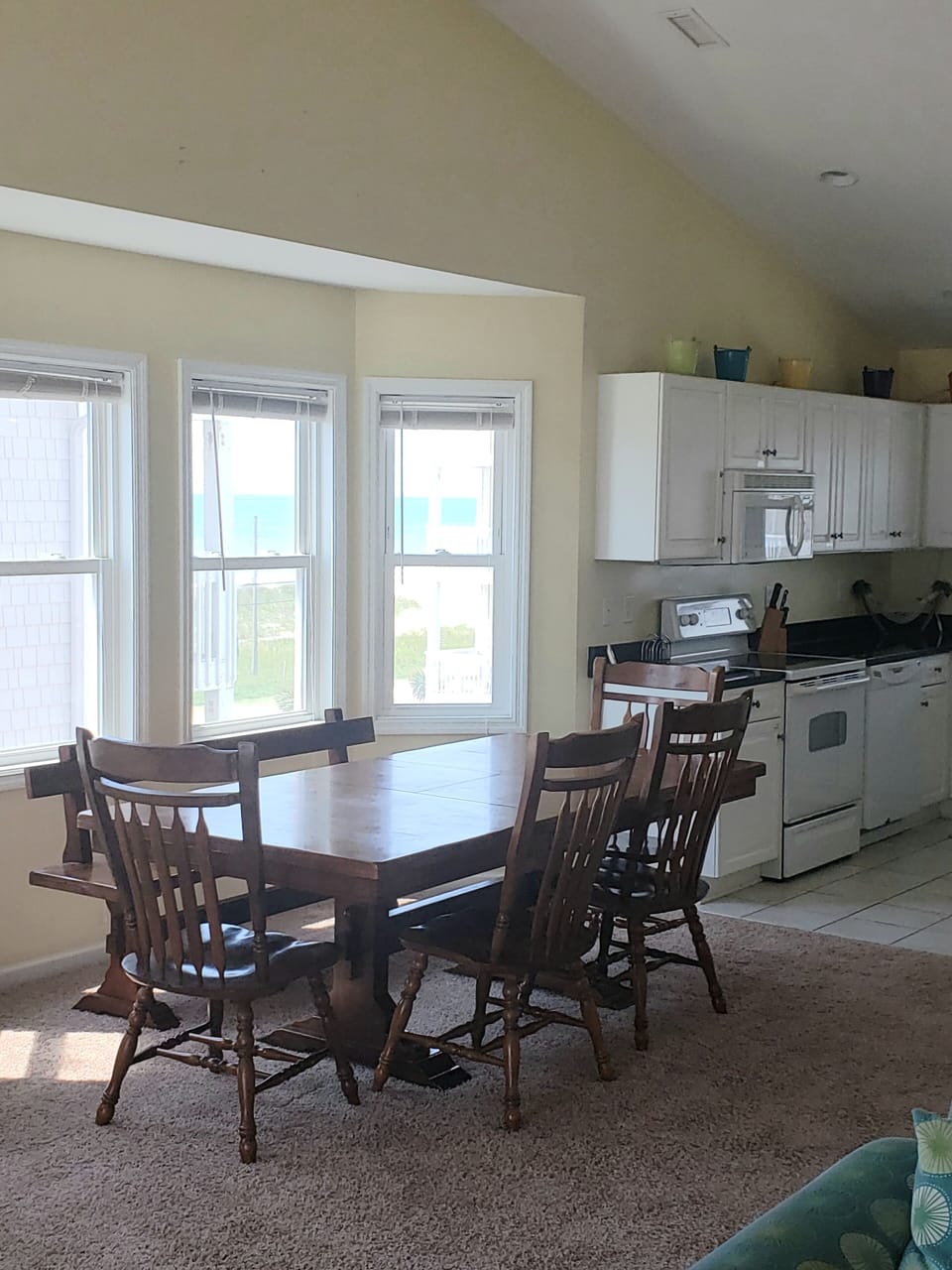 Dining and kitchen area with view of the ocean.