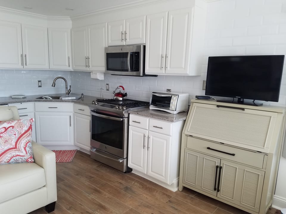 Kitchen area with desk for Guest convenience.