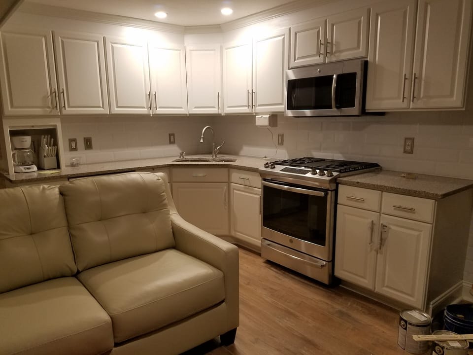 Fully equipped kitchen with overhead lighting
