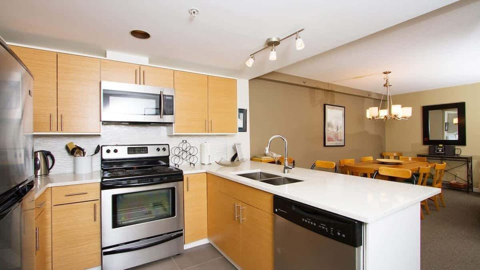 - Modern kitchen with stainless appliances and open layout  
- Whistler vacation rental featuring chef-ready amenities  
- Perfect for cooking and entertaining in mountain comfort  