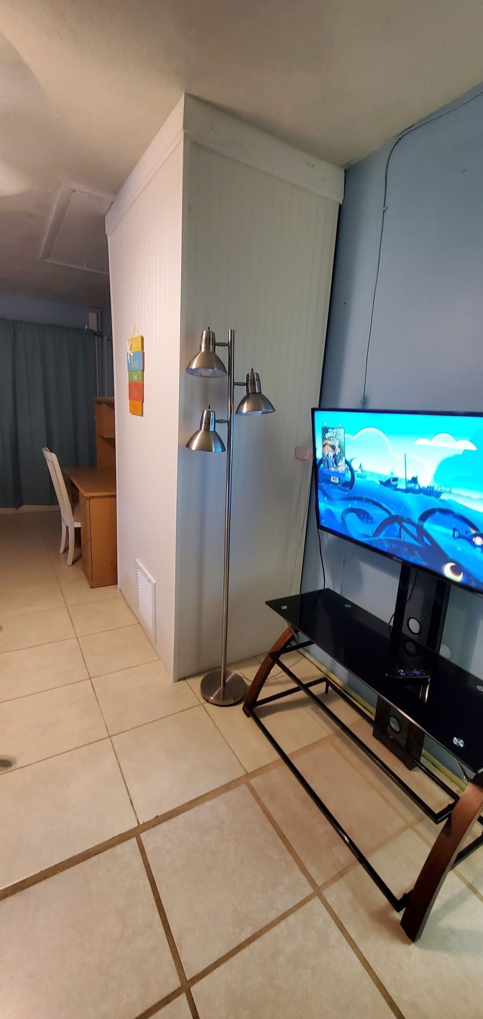Desk and chair and large TV , 4th bedroom
