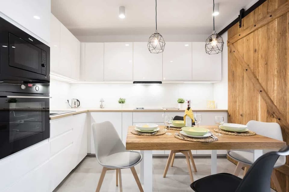 Kitchenette with oven and refrigerator. 