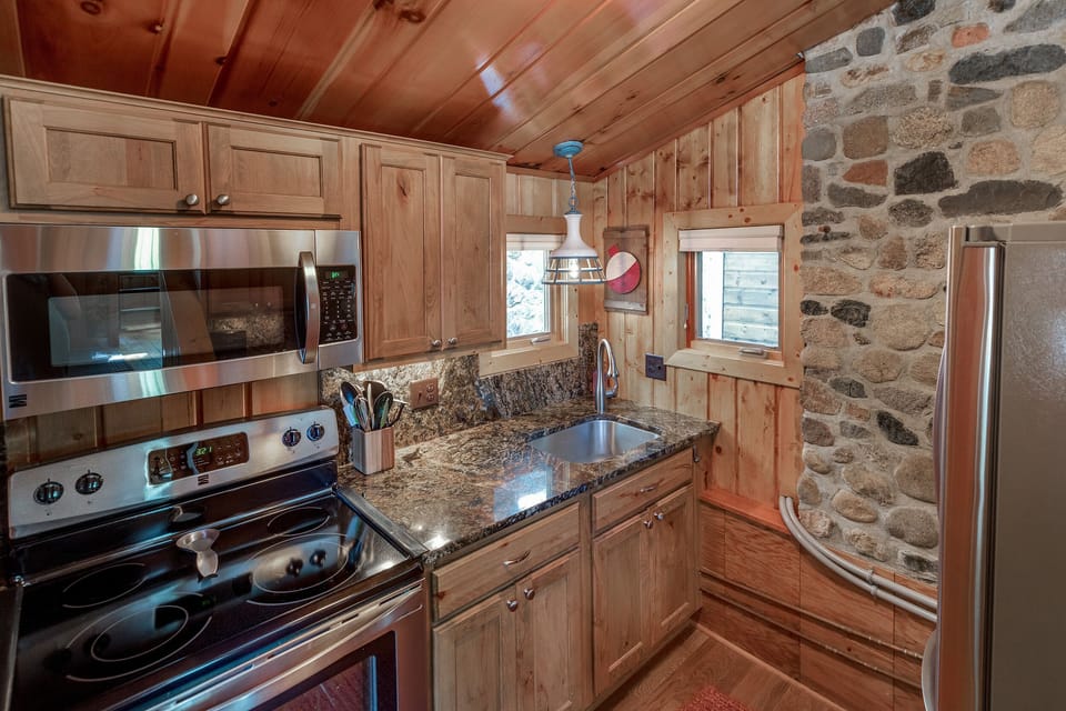 Kitchen with stainless steel appliances and granite countertops.  