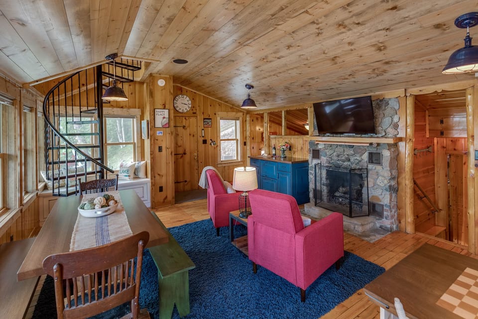 Wood burning fireplace with smart TV above mantel.  DirectTV included.