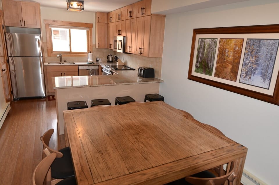Dining Area and Kitchen - Fully equipped kitchen with new appliances and new furnishings. The dining area is large enough for the entire party.