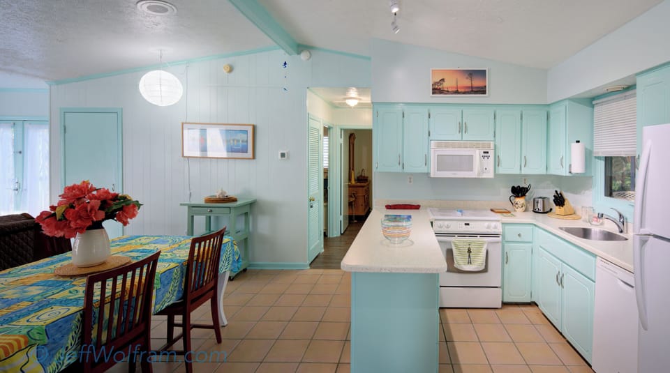 Kitchen with an open floor plan showing the dinning table for six