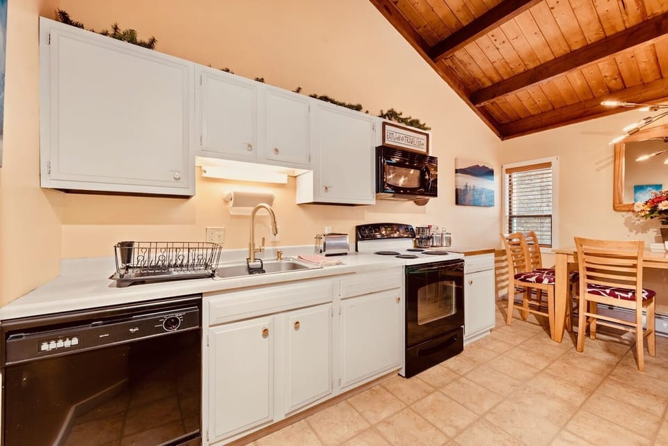 Kitchen with dishwasher, microwave, oven, Ninja blender, Foreman Grill, etc