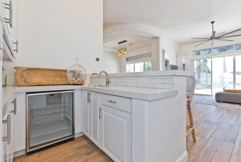 Bar area with wine fridge, sink and seating for 3