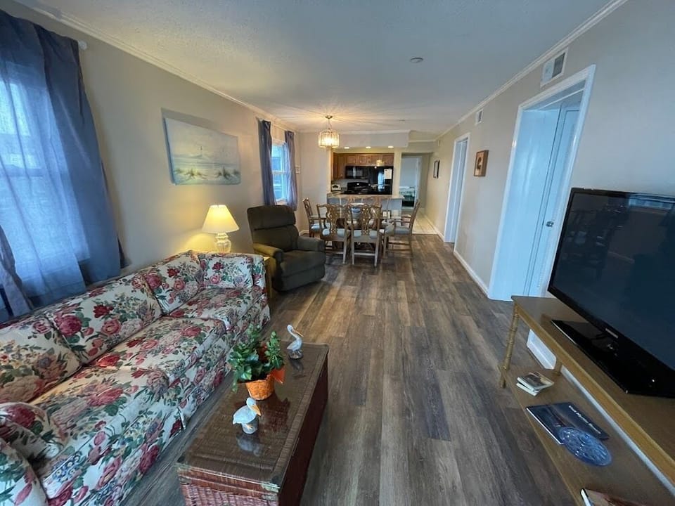 Open living, kitchen and dining areas.
