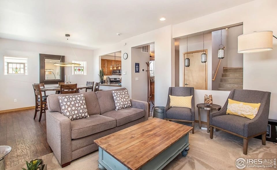 Inside stairs lead to bedrooms and the deck.