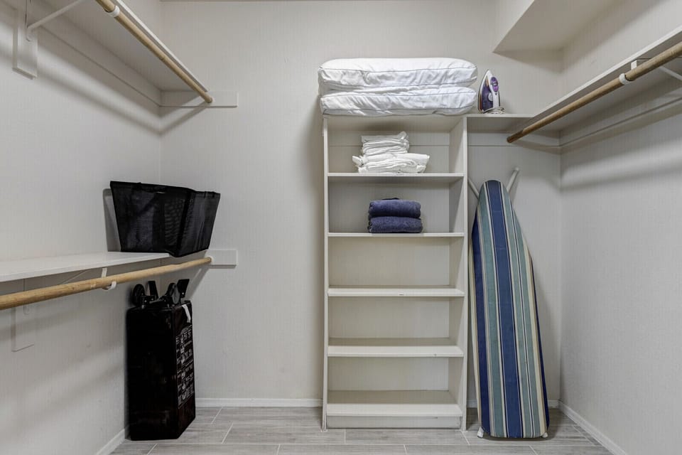 Primary bedroom walk in closet
