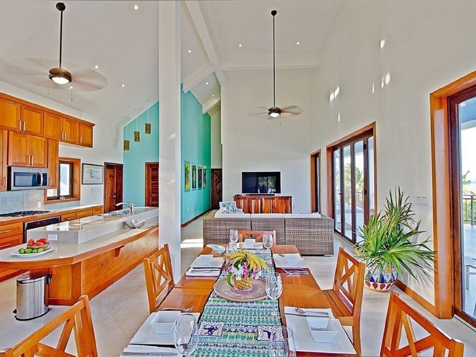 Upper floor living room, dining room, kitchen. 