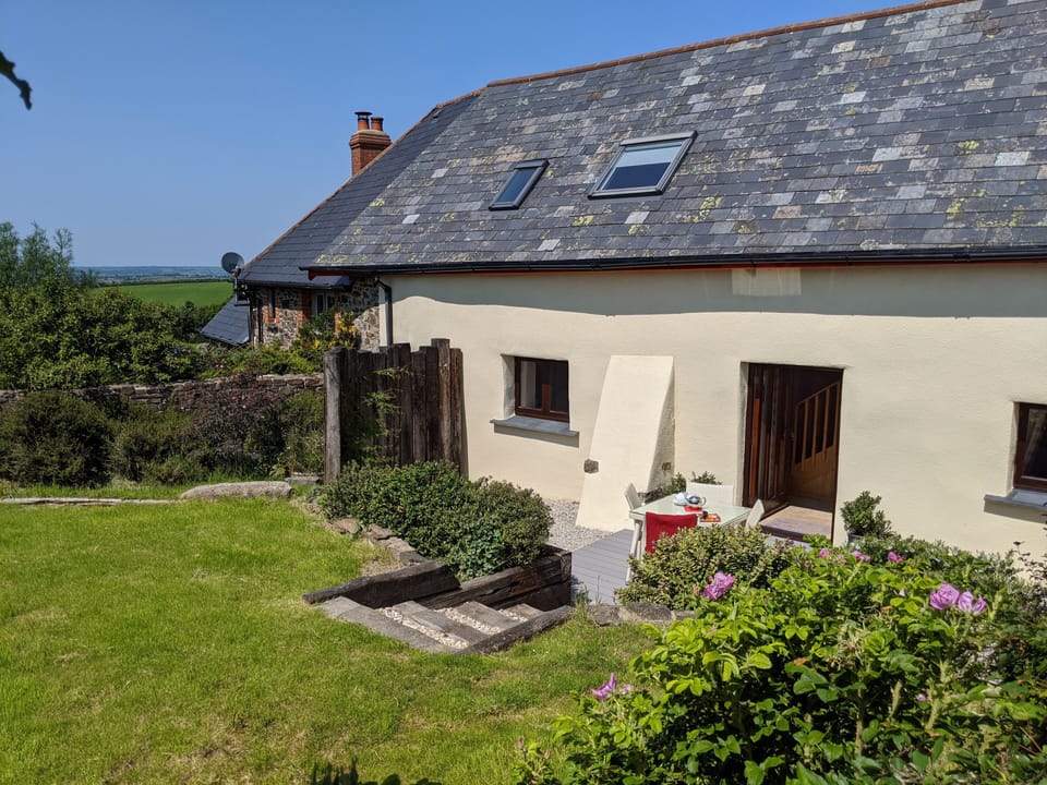 Moonseeker has a decked area with table and chairs, and a lawn. Views to Bude!
