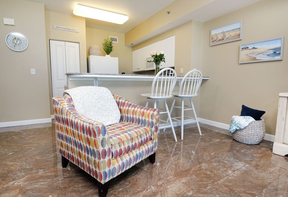 Cozy chair for 1 backing up to Breakfast bar seating for 2