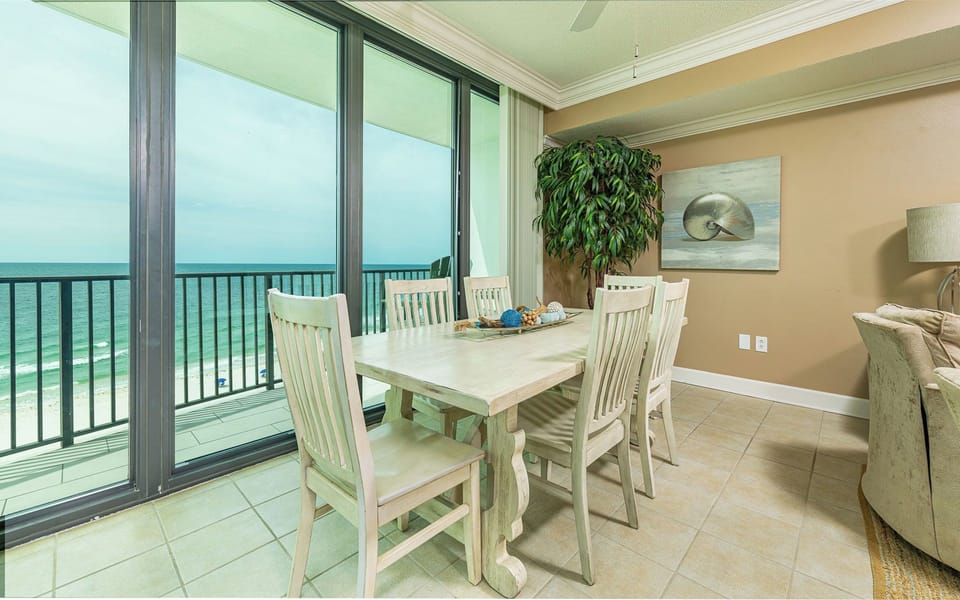 A cozy dining area lets you savor meals while watching gentle waves from the balcony