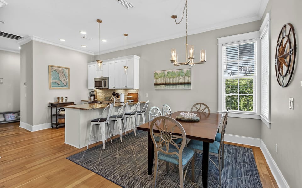Gather around your elegant dining table for memorable meals, while the open kitchen invites culinary adventures with granite counters and modern appliances.