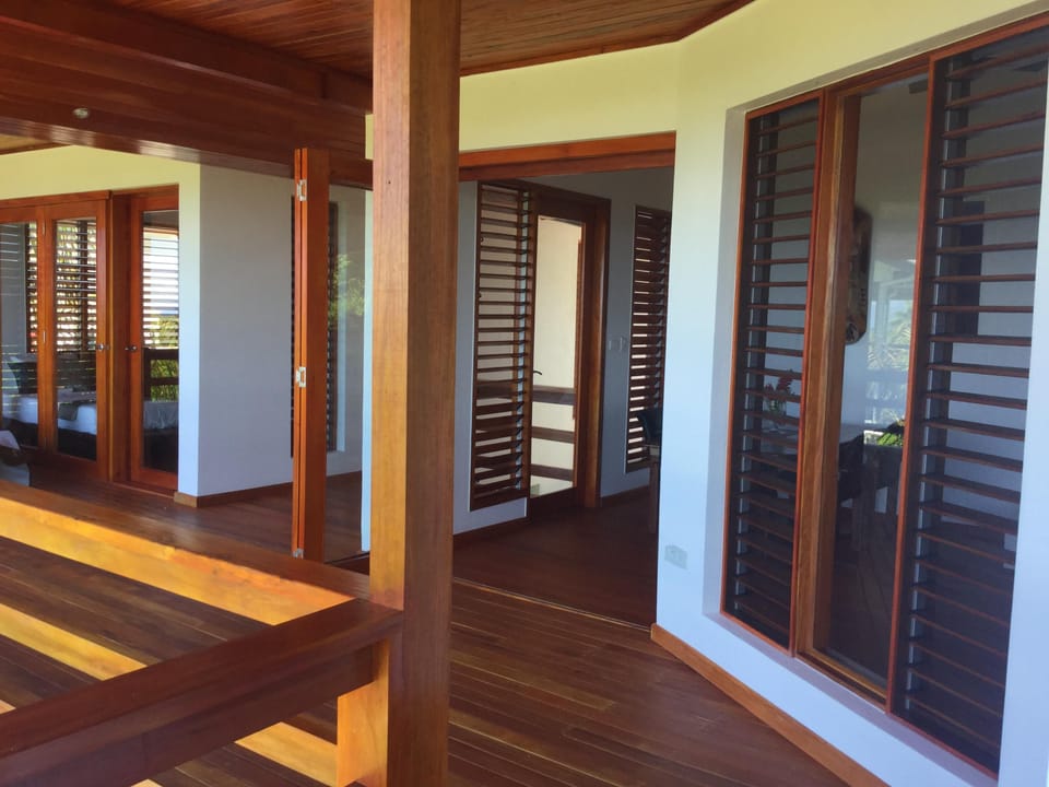 Mahogany deck connecting the main room to the bedroom.