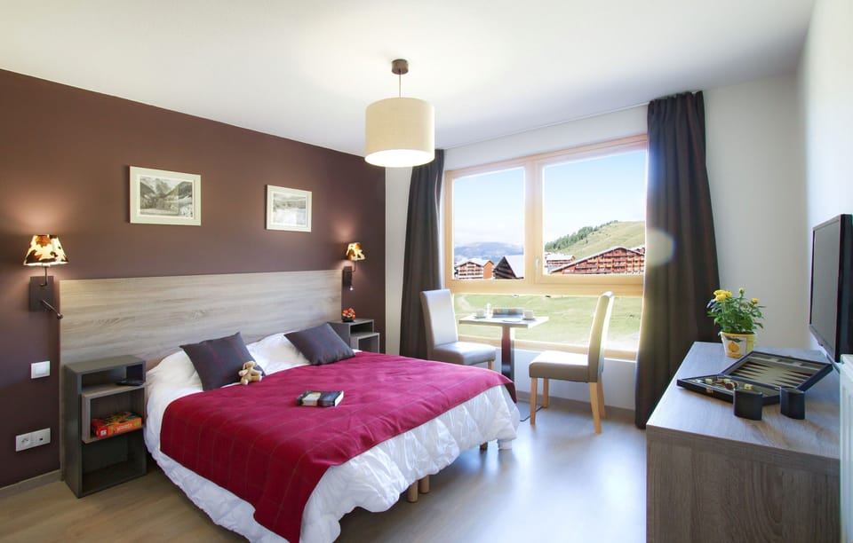 There's either a Double bed or 2 Single beds in the 1 Bedroom Apartment for 4.