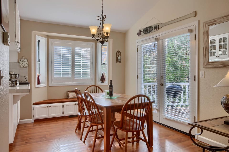 Dining Room with lots of light with French doors leading to wrap around deck