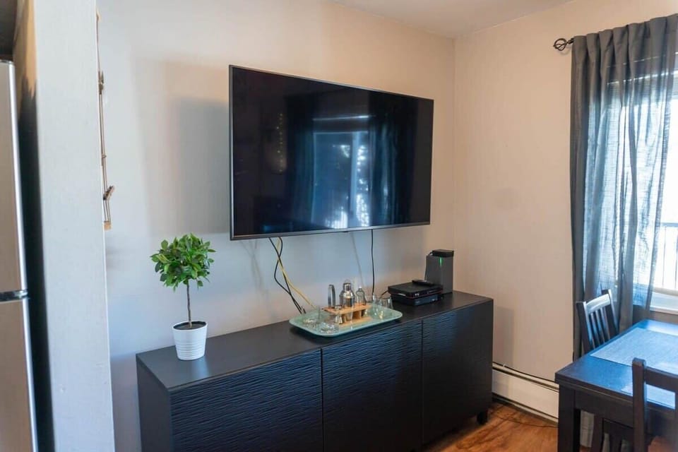 Cozy up to the couch and find a good show or movie on the flat-screen, Smart TV.