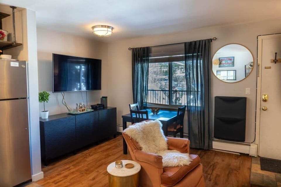 The dining area is located in the living room next to a large window providing incredible views while you have a meal or snack.