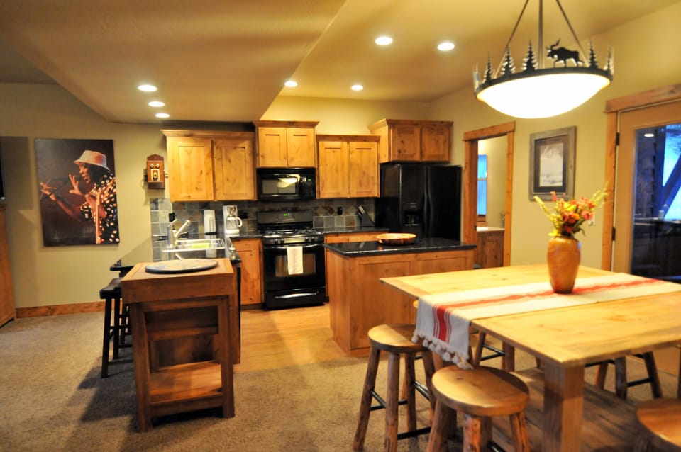 kitchen/dining room to 1/2 bath. Outside to deck with BBQ and Adirondack chairs