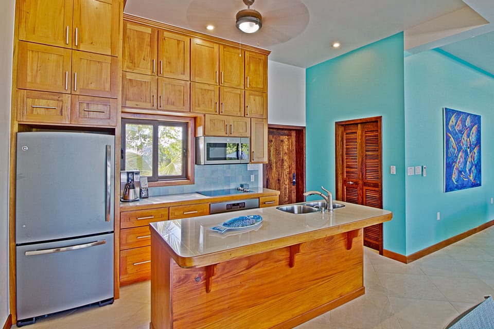 Custom kitchen with mahogany cabinets and Profile GE appliances