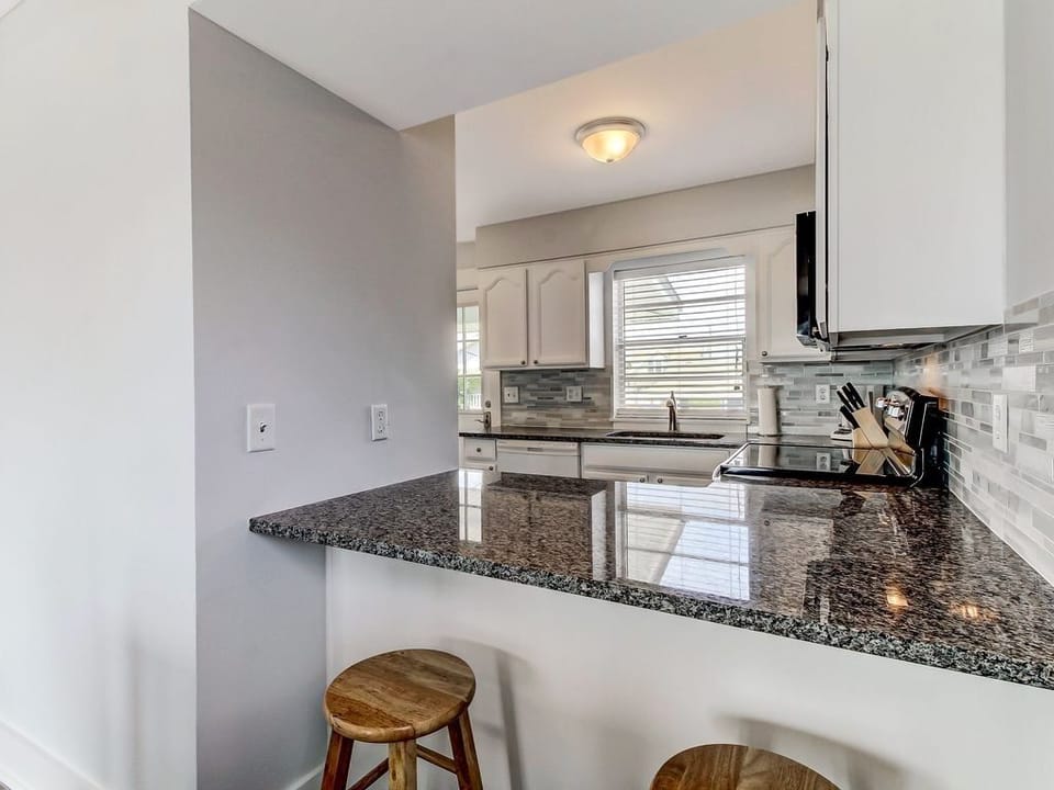 Kitchen view with breakfast bar from the dining area