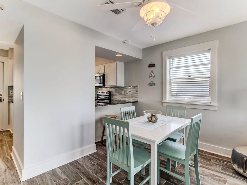 Dining area with breakfast bar in the background
