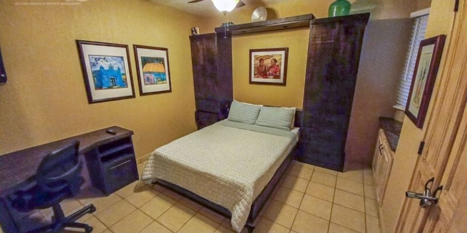 comfortable Queen wall bed in guest bedroom