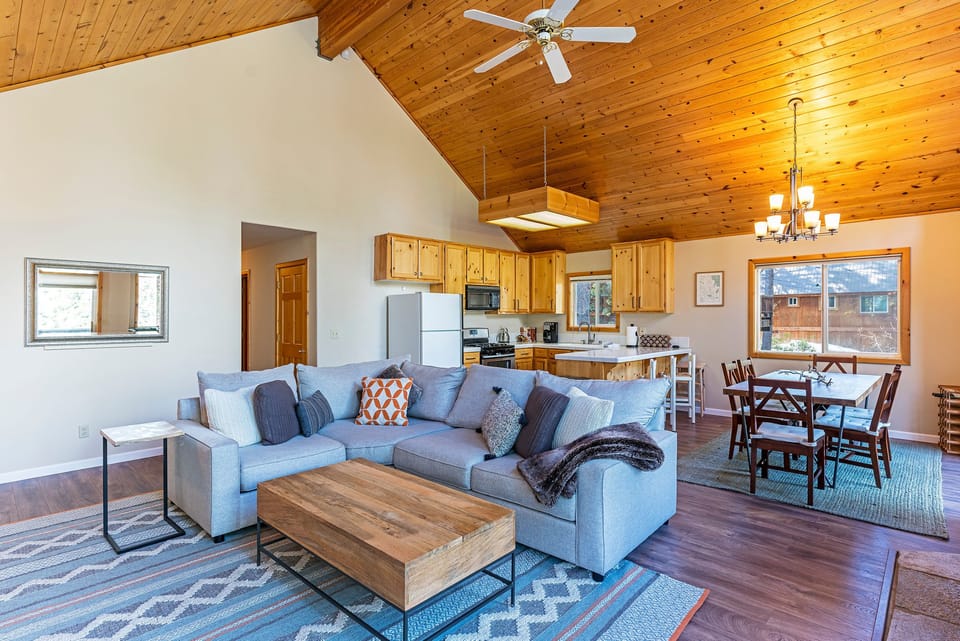 Comfy-L shaped couch, dining space for 6 and open kitchen with breakfast bar