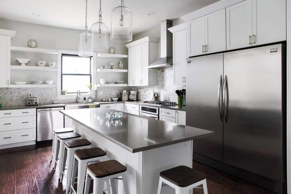  1st FL | Kitchen | Supplied w/ small appliances & cooking staples such as olive oil, salt, and pepper. 