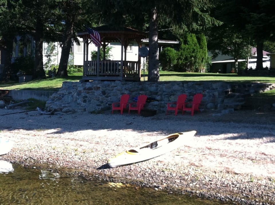 Enjoy the gazebo, sandy beach, fire pit, kayak and SUP during your stay