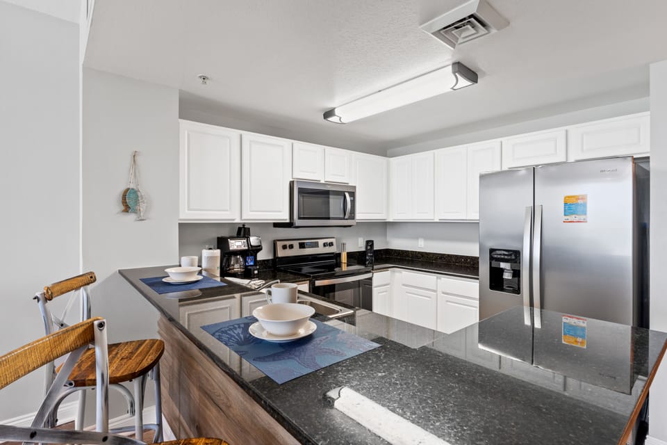Fully Stocked Kitchen with Bar Seating