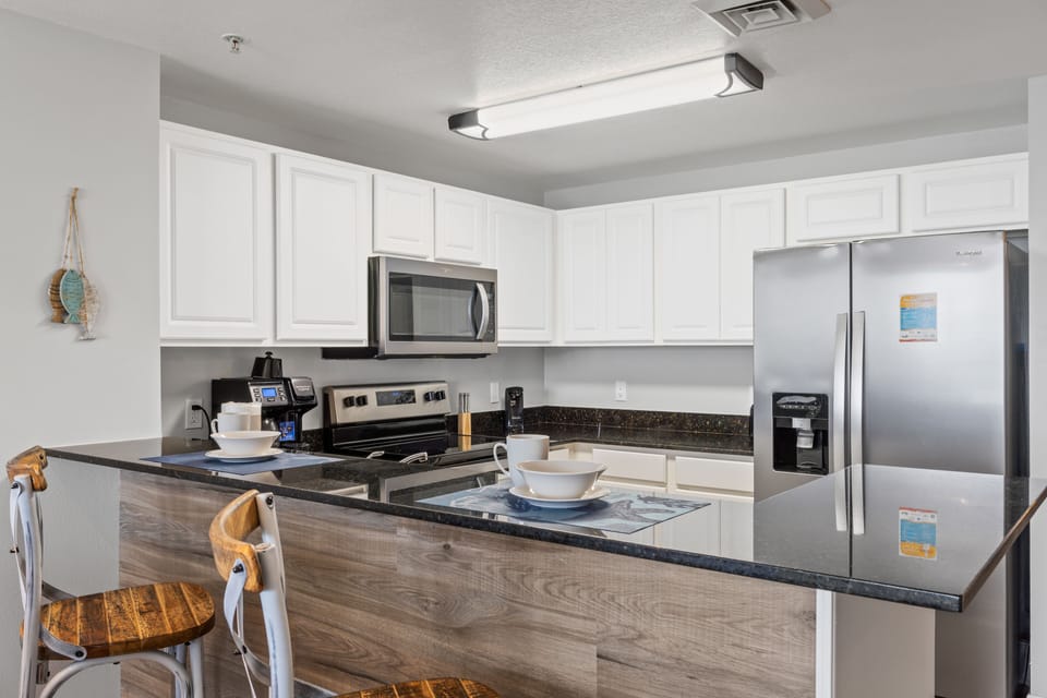 Fully Stocked Kitchen with Bar Seating