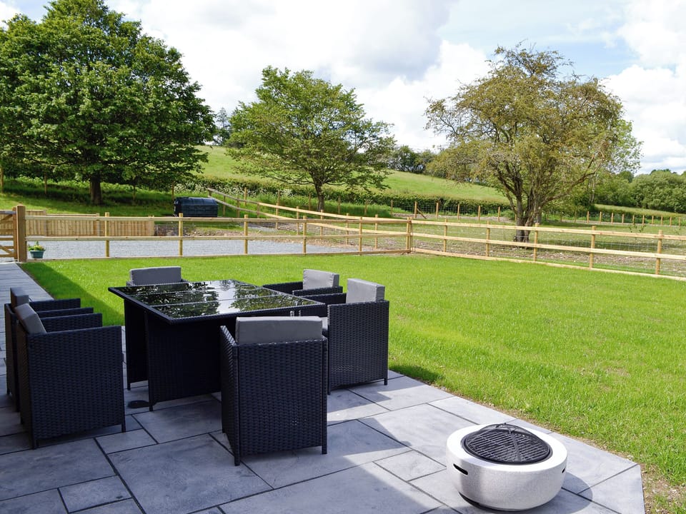 Sitting out area | River Lodge - Bryncoch Holidays, Hundred House, near Builth Wells