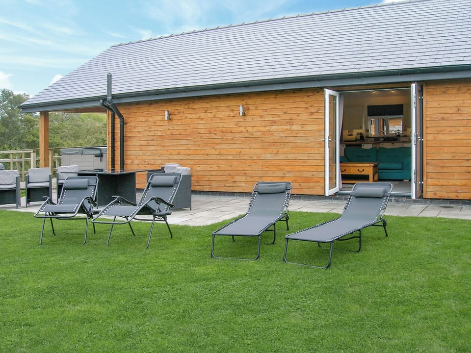 Sitting-out-area | River Lodge - Bryncoch Holidays, Hundred House, near Builth Wells