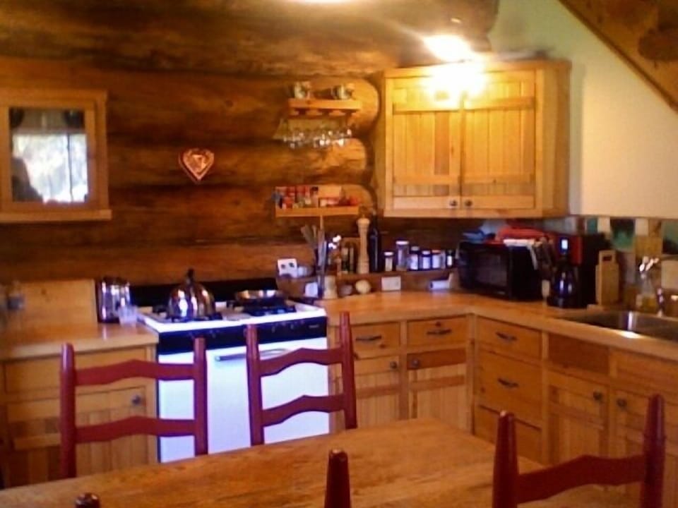 Kitchen, hand crafted cabinets. Gas stove. Dish washer, microwave, fridge.