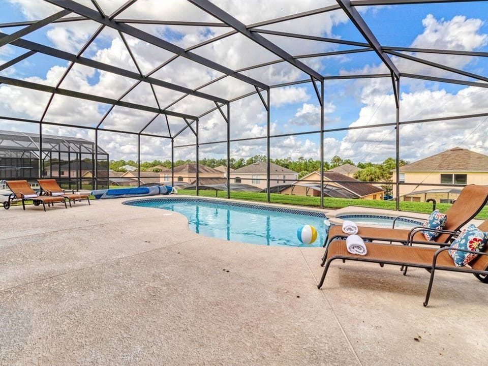 Lounge by the private pool in comfortable sun chairs 