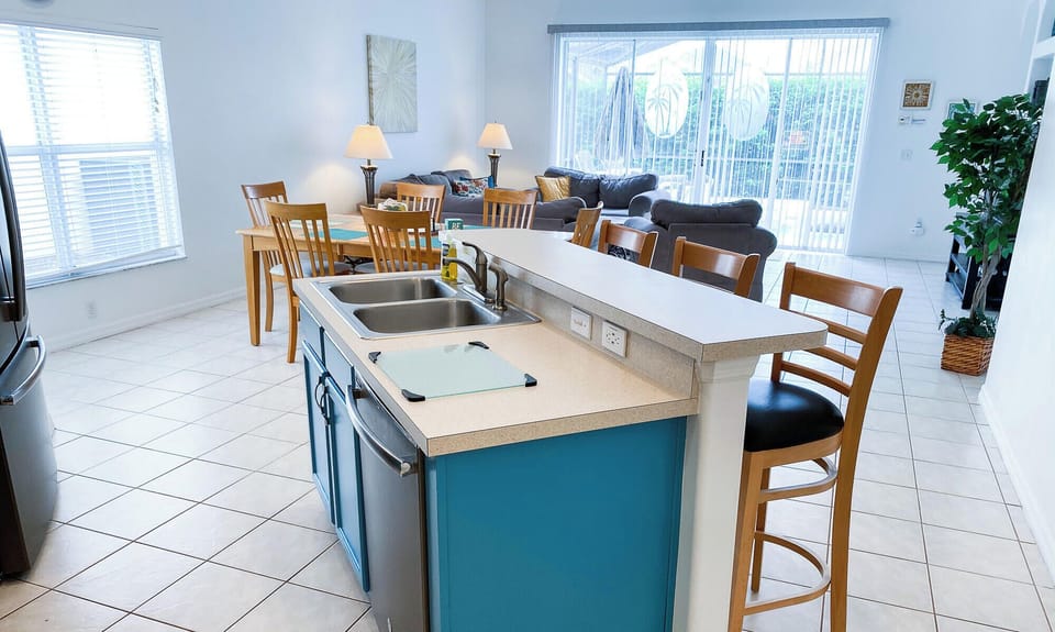 Kitchen island looks into living room.